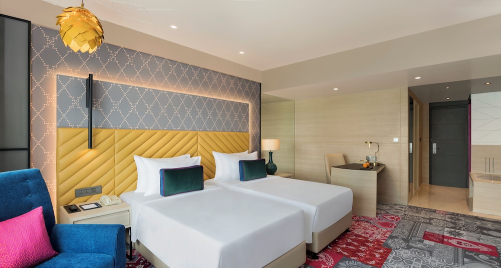 Habitación Deluxe con 2 camas individuales del hotel Grand Mercure Agra. Foto 3