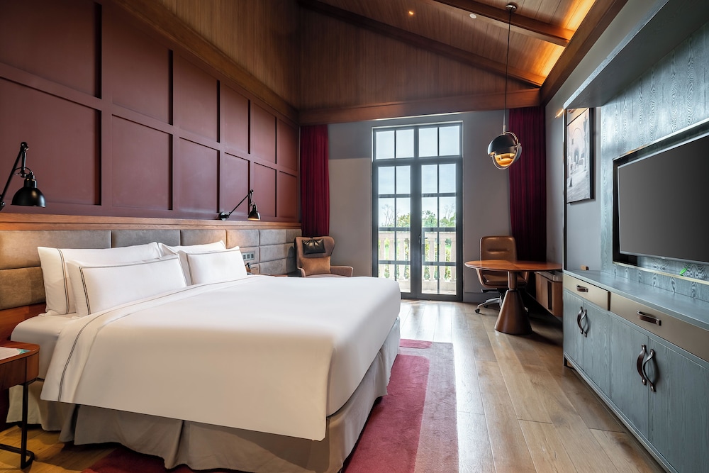 Habitación Deluxe con vistas al jardín del hotel Melia Shanghai Parkside. Foto 4