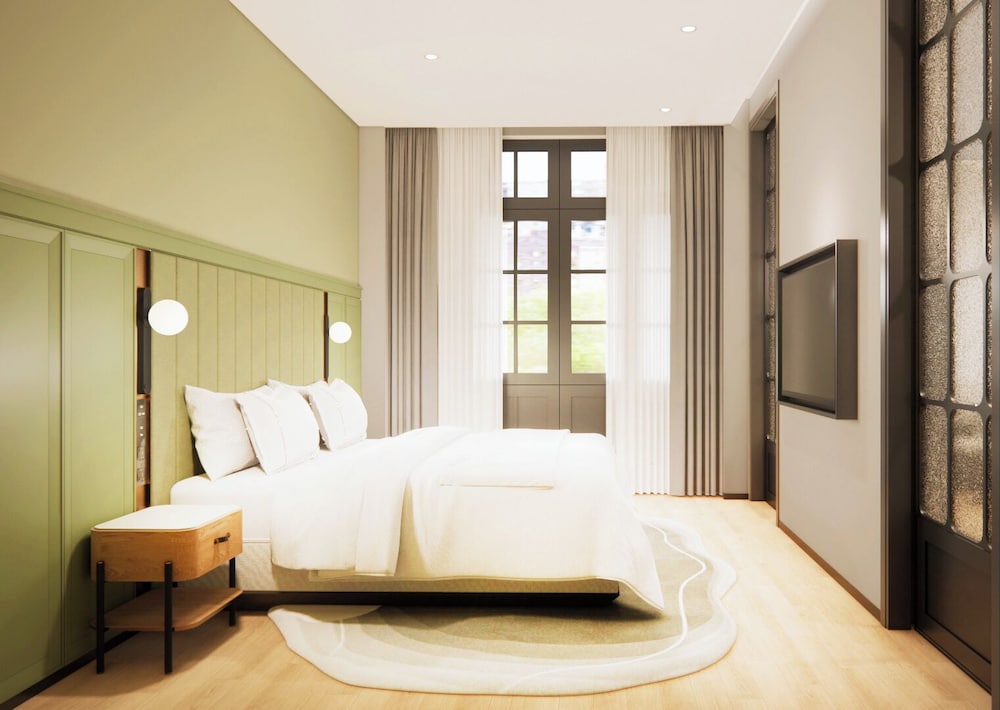Habitación Junior Suite con vistas al jardín del hotel Melia Shanghai Parkside
