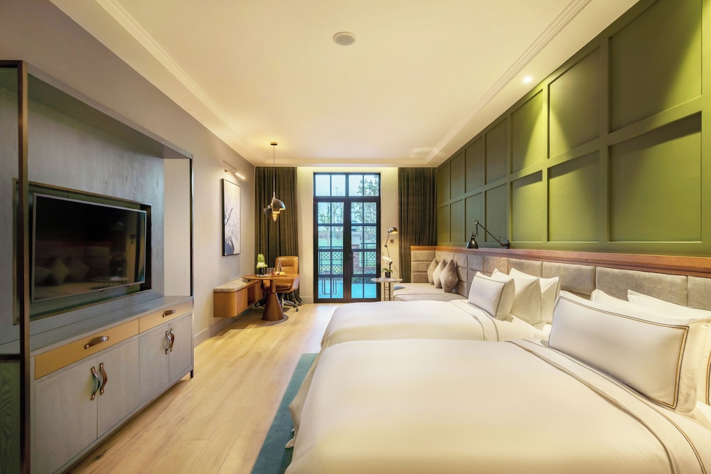 Habitación Premium con terraza y vistas al jardín del hotel Melia Shanghai Parkside. Foto 4