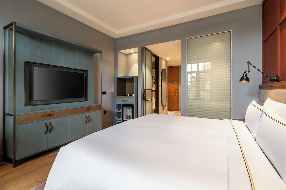 Habitación Premium con terraza y vistas al jardín del hotel Melia Shanghai Parkside. Foto 6