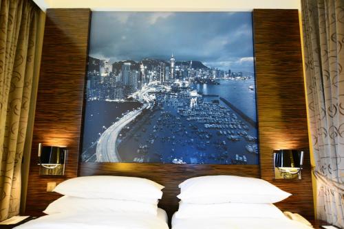 Habitación Doble Premier con vistas al puerto - 1 cama extragrande o 2 camas del hotel Harbour Grand Hong Kong. Foto 1