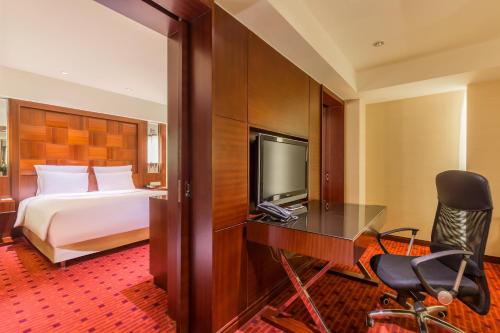 Suite Deluxe del hotel Beijing Pudi. Foto 1
