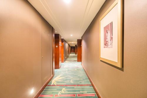 Habitación Doble Superior del hotel Beijing Pudi. Foto 3