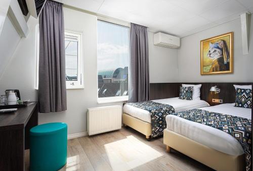 Habitación Doble - 2 camas del hotel Damsquare. Foto 6