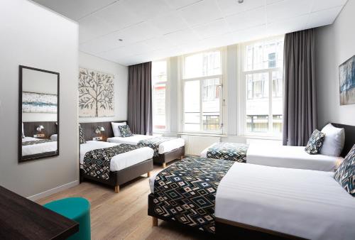 Habitación Cuádruple del hotel Damsquare. Foto 1