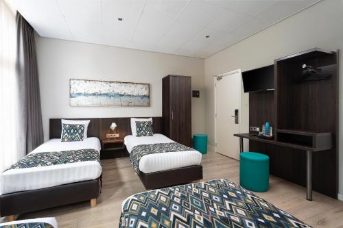 Habitación Cuádruple del hotel Damsquare. Foto 3