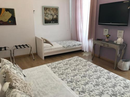 Habitación Doble Deluxe con cama supletoria del hotel Un Patio Al Sur. Foto 6