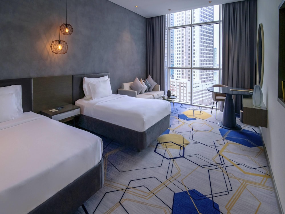 Habitación Superior con Dos Camas Individuales - Vistas a la Ciudad del hotel Pullman Sharjah