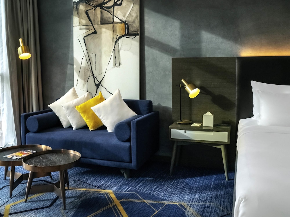 Habitación Deluxe con Dos Camas Individuales - Vistas a la Laguna del hotel Pullman Sharjah. Foto 1