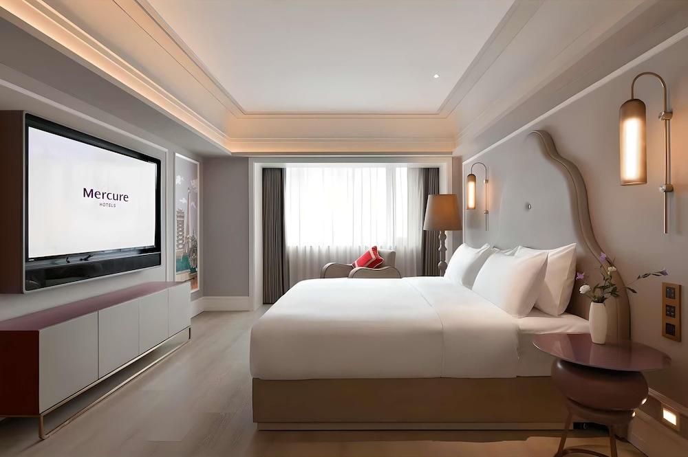 Habitación Deluxe, 1 cama de matrimonio grande del hotel Mercure Chengdu Jinniu Wanda Plaza. Foto 5