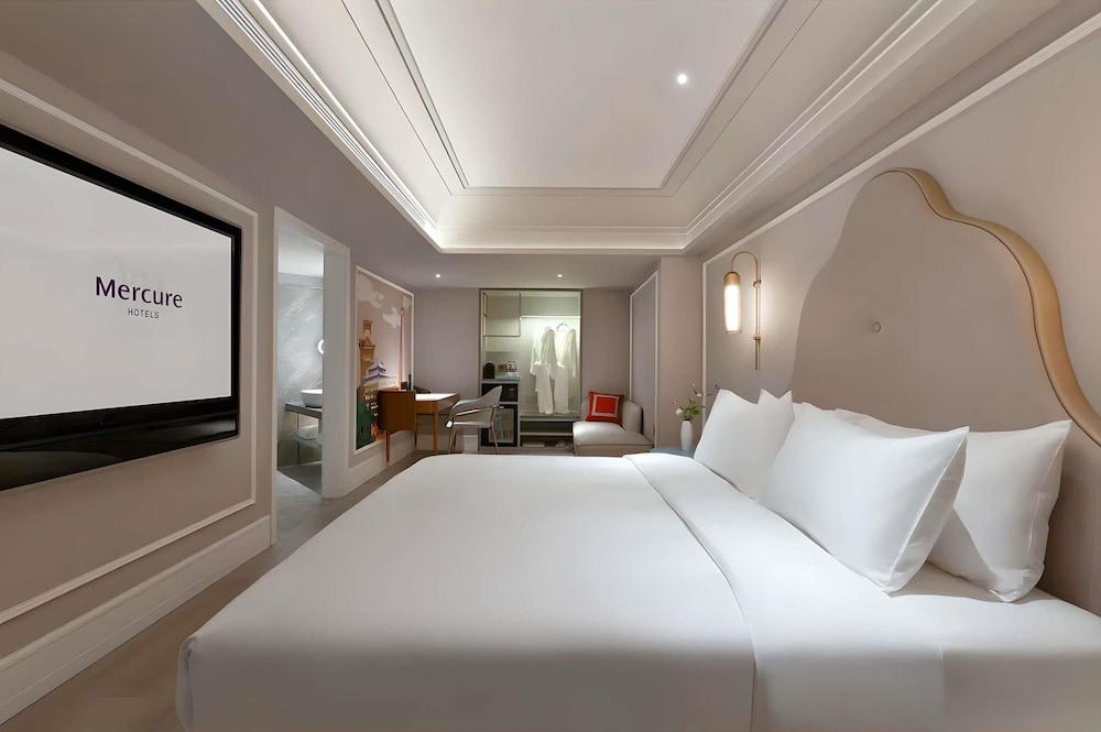 Privilege, Habitación, 1 cama de matrimonio grande del hotel Mercure Chengdu Jinniu Wanda Plaza. Foto 3
