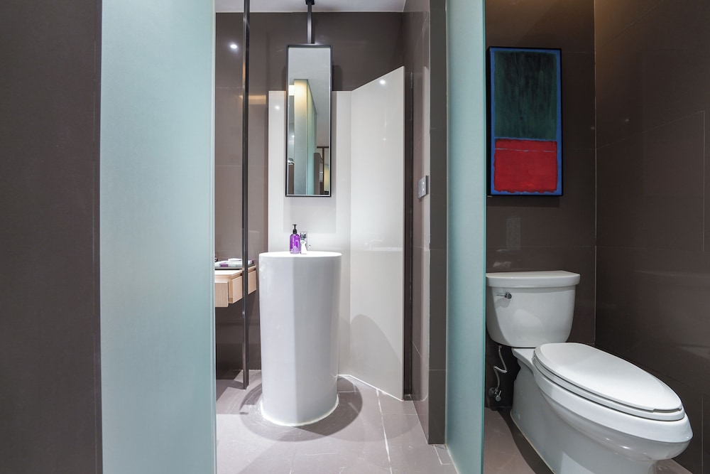 Habitación Deluxe con 2 camas individuales del hotel Mercure Nanjing Olympic Expo. Foto 4