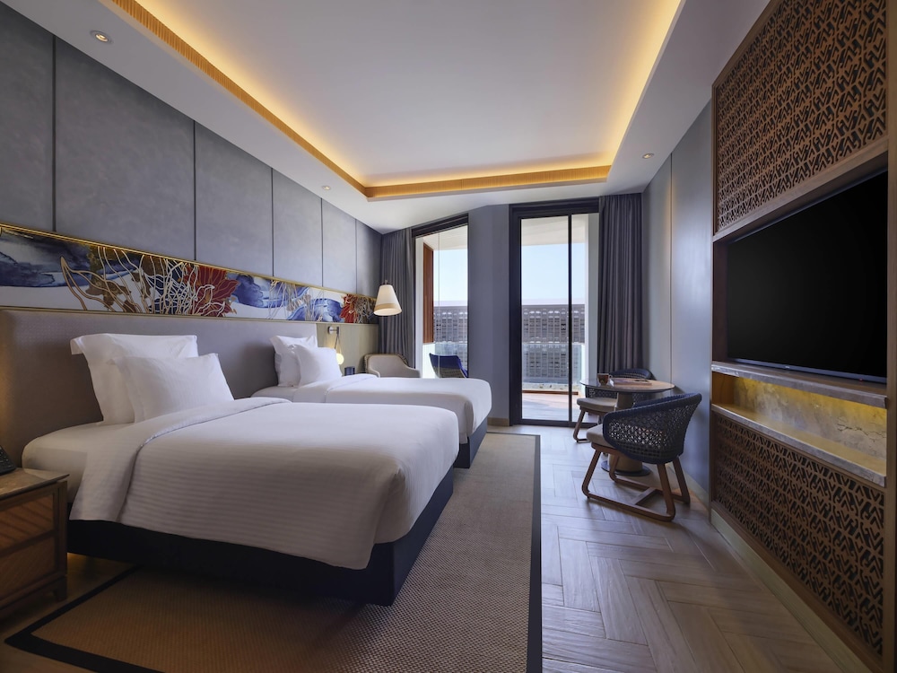 Habitación Deluxe, 2 Camas Individuales, Balcón, Lado del Jardín del hotel Pullman Lombok Merujani Mandalika Beach Resort
