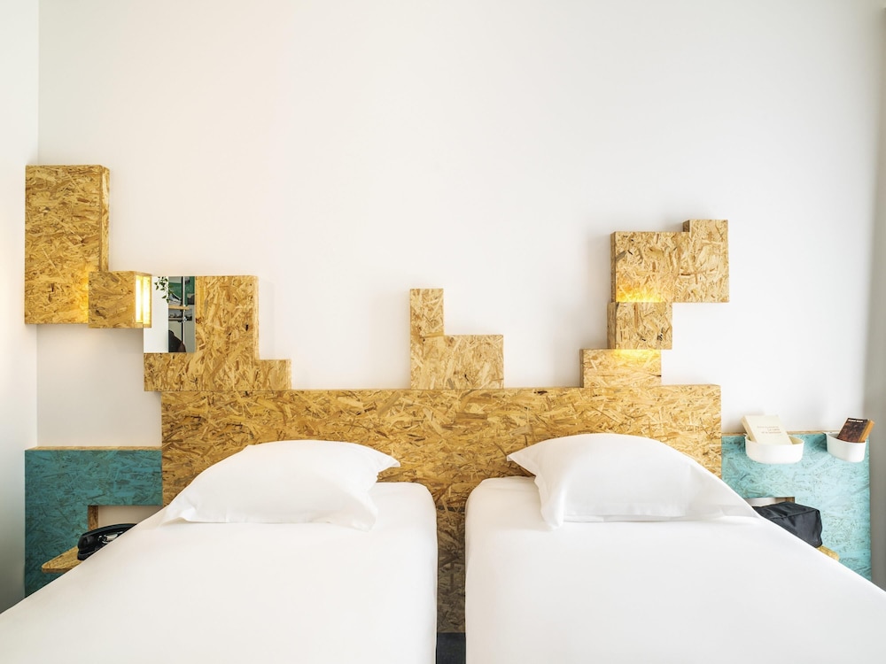 Habitación Pure con dos camas individuales del hotel Greet Rennes Pace