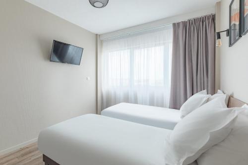 Estudio con 2 camas individuales del hotel Appart'city Classic Bordeaux Centre. Foto 3