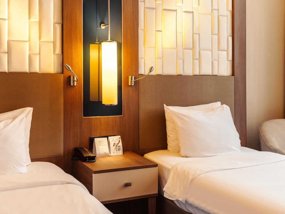 Habitación estándar con 2 camas individuales del hotel Tbilisi Philharmonic By Mercure. Foto 9