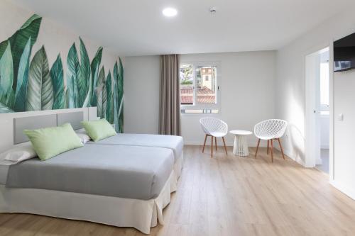 Habitación con vistas a la ciudad - 2 camas del hotel Boutique Maga. Foto 3