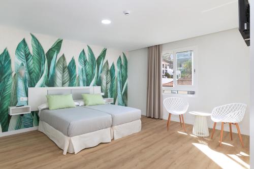 Habitación con vistas a la ciudad - 2 camas del hotel Boutique Maga. Foto 1