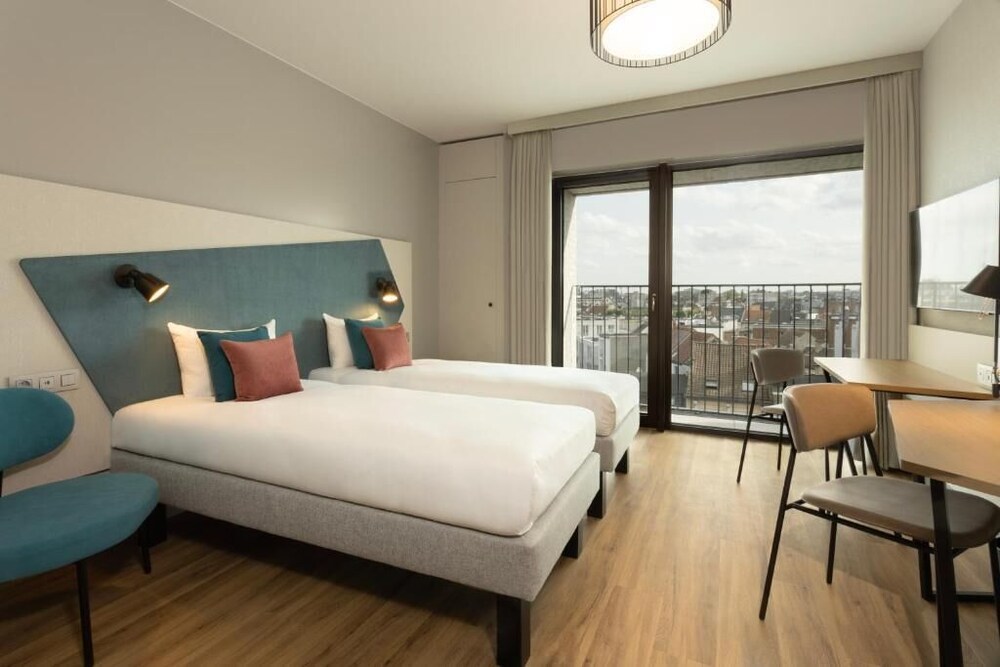 Estudio, 2 camas individuales del hotel Adagio Antwerp City Center. Foto 7