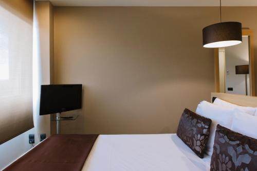 Habitación Doble con cama supletoria del hotel Pcm Forum Alcalá. Foto 2
