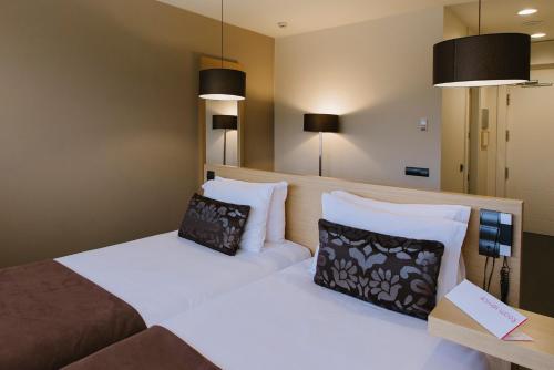 Habitación Doble con cama supletoria del hotel Pcm Forum Alcalá. Foto 5