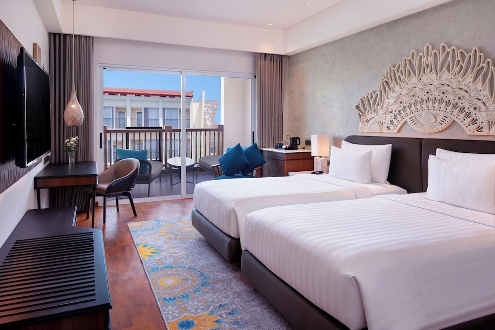 Habitación Deluxe con dos camas individuales del hotel Grand Mercure Bali Seminyak. Foto 2