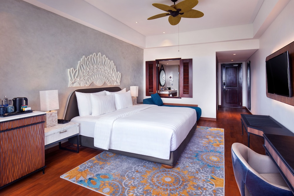Habitación Deluxe King - Vistas al Jardín del hotel Grand Mercure Bali Seminyak. Foto 1