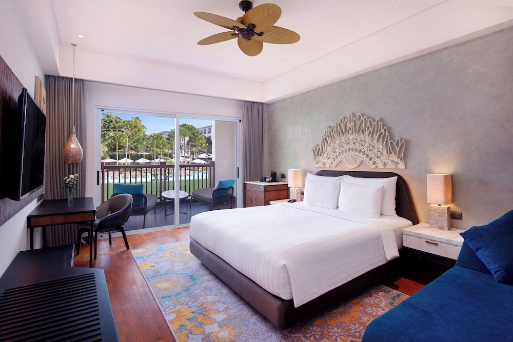 Habitación Deluxe King - Vistas a la Piscina del hotel Grand Mercure Bali Seminyak. Foto 1