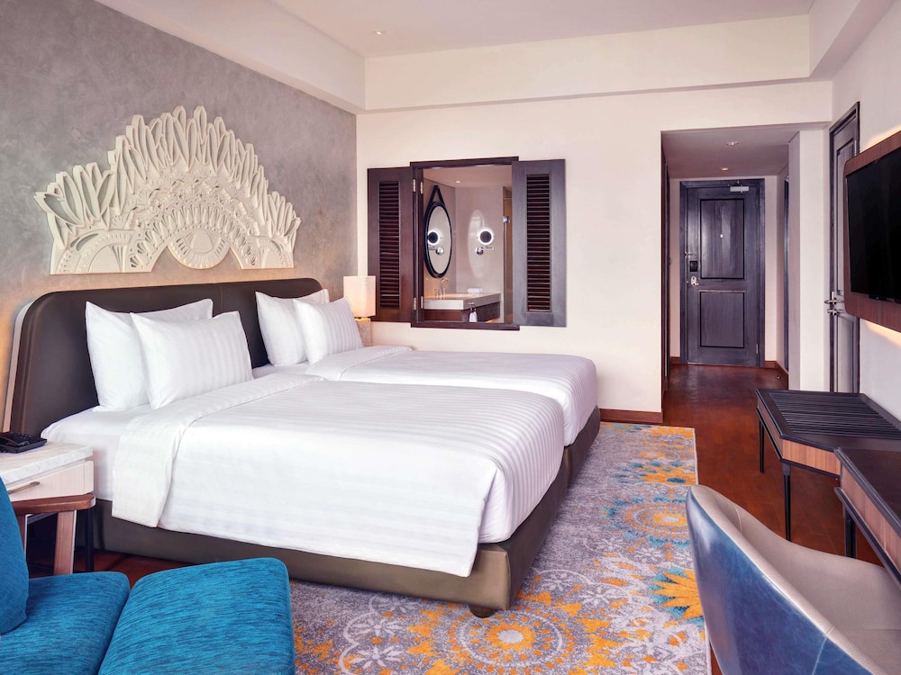 Suite Junior con Dos Camas Individuales del hotel Grand Mercure Bali Seminyak. Foto 3