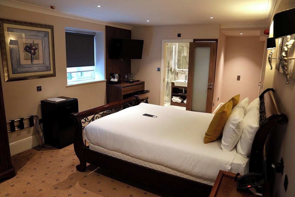 Habitación triple ejecutiva del hotel The Tudor