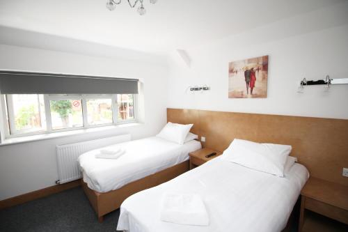 Habitación Doble con baño privado - 2 camas del hotel Flexistay Aparthotel Sutton. Foto 4