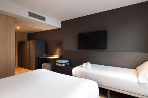 Habitación Triple del hotel Hotel SB Win. Foto 1