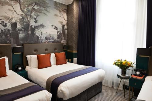 Habitación Triple Deluxe del hotel The Portico. Foto 3