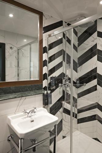 Habitación Cuádruple Deluxe del hotel The Portico. Foto 1