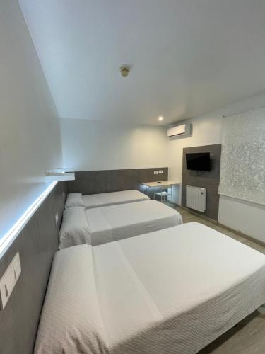 Habitación Triple del hotel Condedu Badajoz. Foto 3