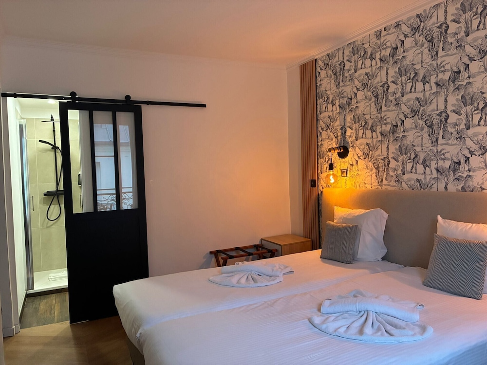 Habitación superior con 2 camas individuales del hotel Le Twelve. Foto 2