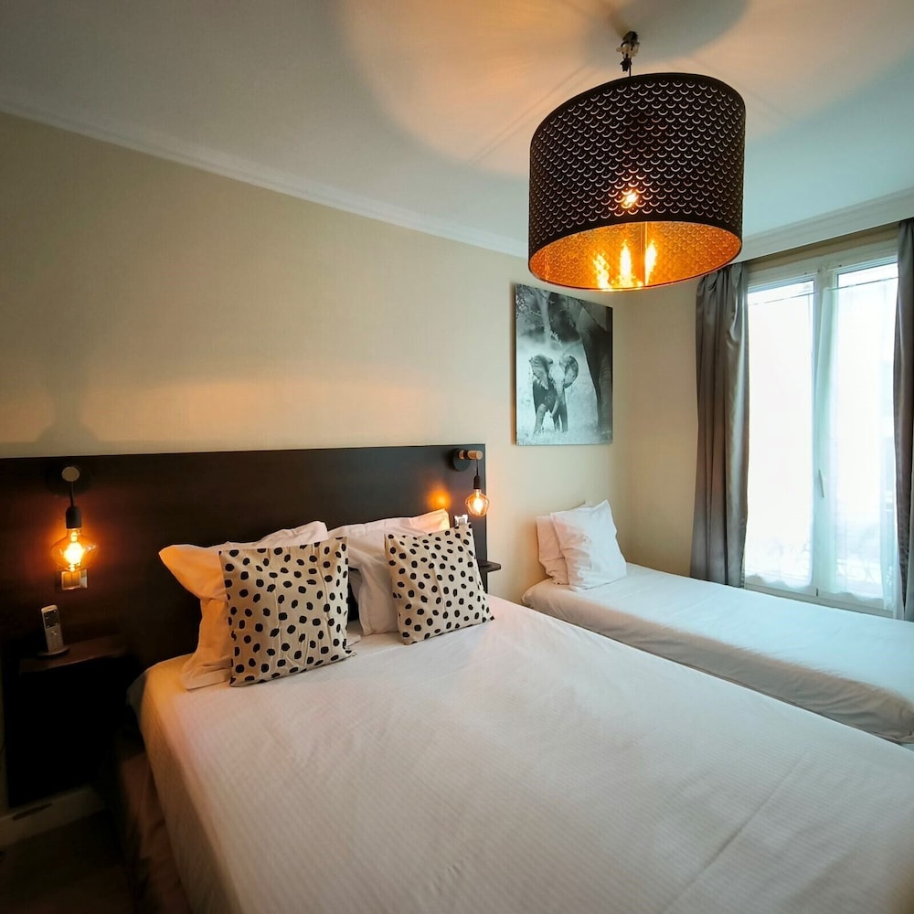 Habitación triple del hotel Le Twelve