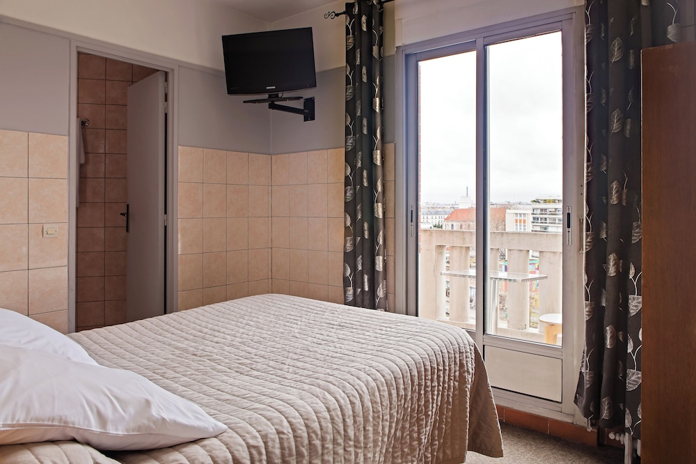 Habitación Confort doble, balcón del hotel Hôtel de la Comète. Foto 2
