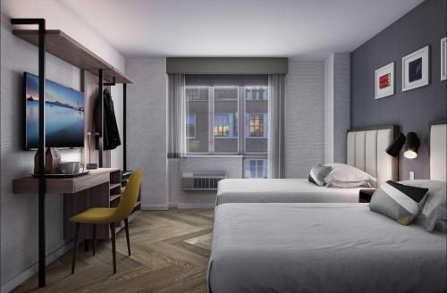 Habitación Doble Estándar adaptada para personas con movilidad reducida con ducha accesible en silla de ruedas del hotel Voco Times Square South, an IHG. Foto 1
