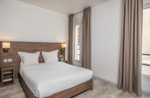 Habitación Doble Confort con vistas a la calle del hotel La Perle Montparnasse