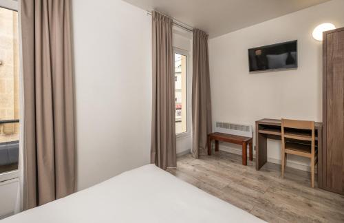 Habitación Doble Confort con vistas a la calle del hotel La Perle Montparnasse. Foto 3