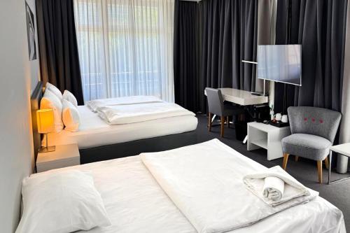 Habitación familiar Premium con cama extragrande y sofá cama del hotel Garner Berlin - Gendarmenmarkt. Foto 5