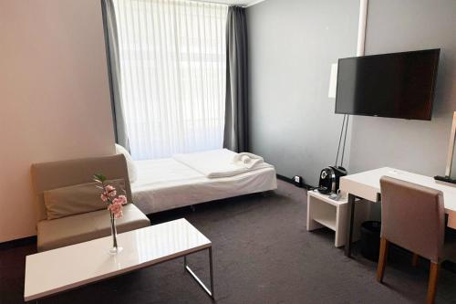Habitación familiar Premium con cama extragrande y sofá cama del hotel Garner Berlin - Gendarmenmarkt. Foto 6