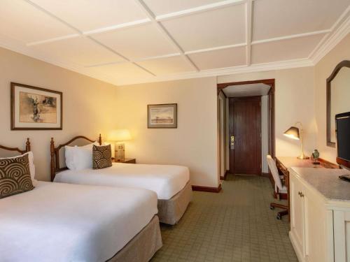 Habitación Deluxe con Patio Interior y 2 Camas Individuales del hotel Fairmont The Norfolk. Foto 3