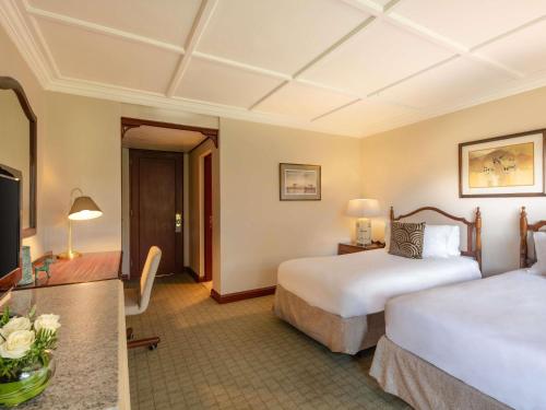 Habitación Deluxe con Patio Interior y 2 Camas Individuales del hotel Fairmont The Norfolk. Foto 5
