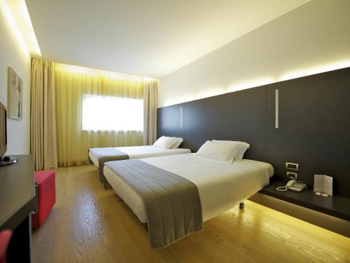 Habitación Classic con 2 camas individuales del hotel Mercure Nerocubo Rovereto. Foto 1