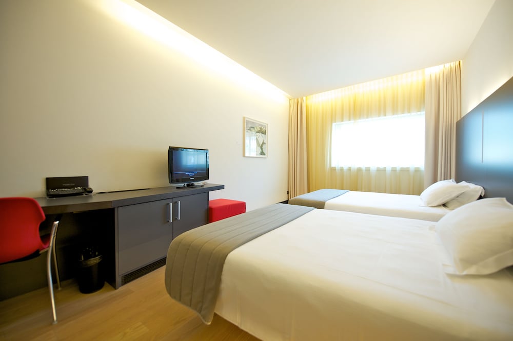 Habitación familiar con 2 camas de matrimonio del hotel Mercure Nerocubo Rovereto. Foto 5