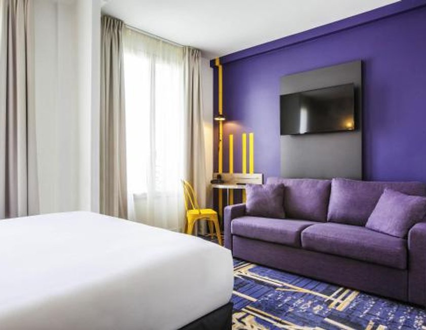 Habitación cuádruple 2 Camas individuales 1 Cama doble del hotel Ibis Styles Paris Mairie De Clichy. Foto 1