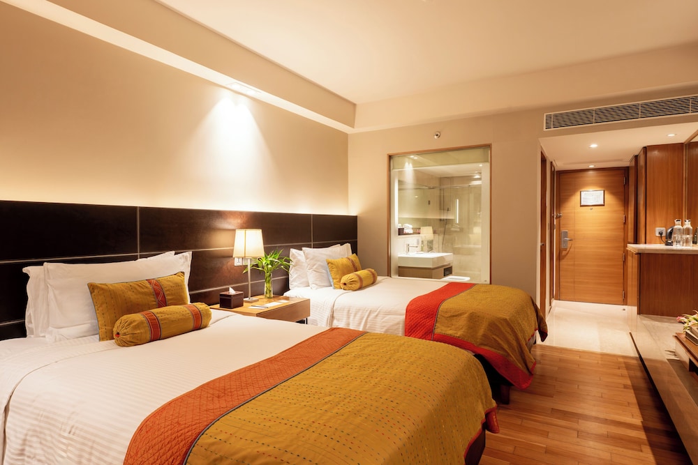 Habitación Deluxe Twin del hotel The Lalit New Delhi. Foto 1